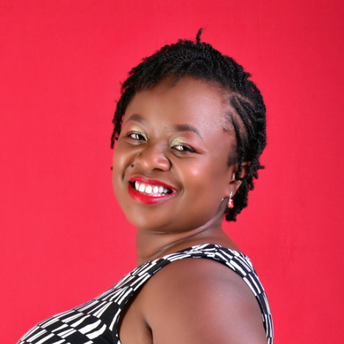 Potrait studio photo of Annabell smiling wearing a black and white dress